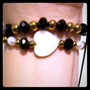 Two Black & Gold Bracelets